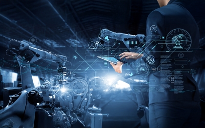 Industry 5.0 smart factory with AI-driven robotic arms and digital control by engineer